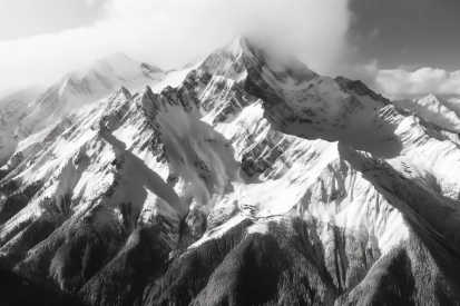 A snowy mountain with clouds