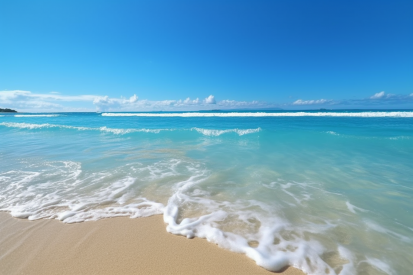 A beach with waves and blue sky