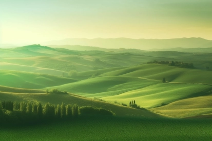 A rolling hills with trees and a house in the distance