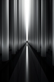 A person walking in a tunnel of columns