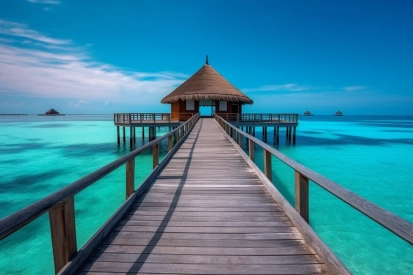 A wooden walkway leading to a hut on water