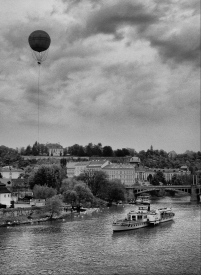 Balloon over river with boat