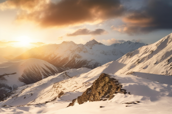 A snowy mountain range with sun shining through clouds
