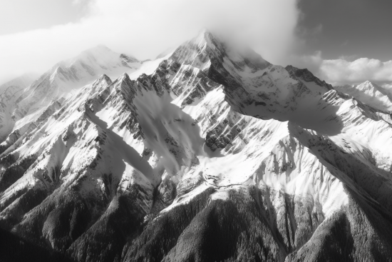 A snowy mountain with clouds