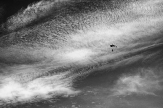 Summer sky with clouds and skydiver